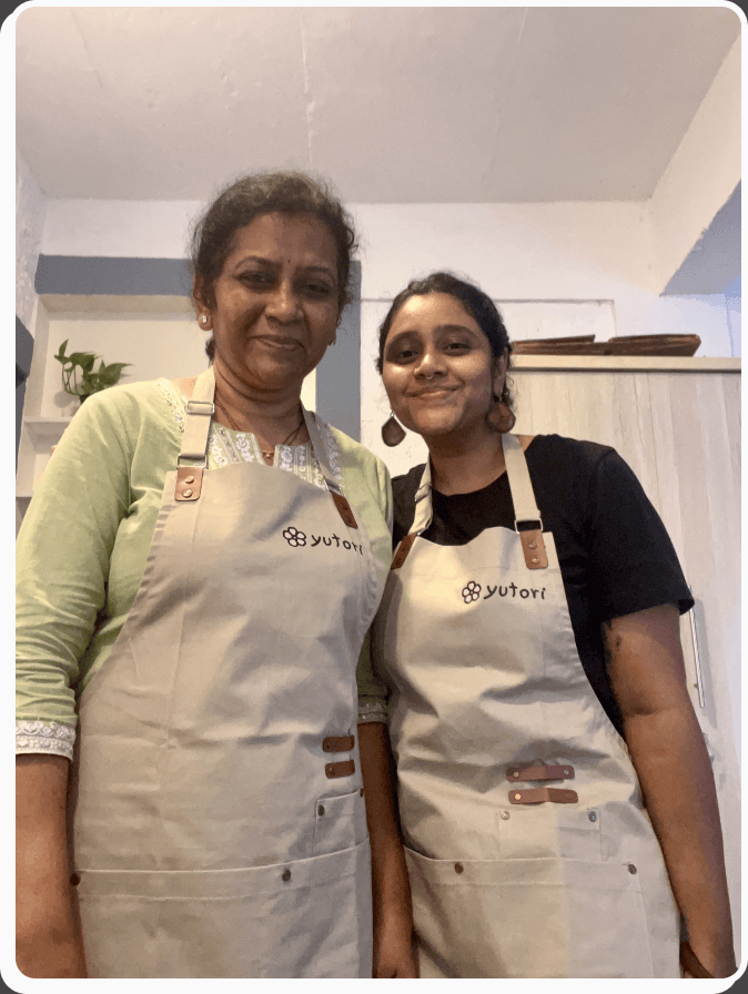 Geet and a teammate in Yutori aprons in the Goa kitchen